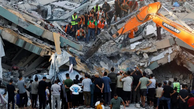 Gaza rescuers dig with bare hands as collapsed building toll reaches 12