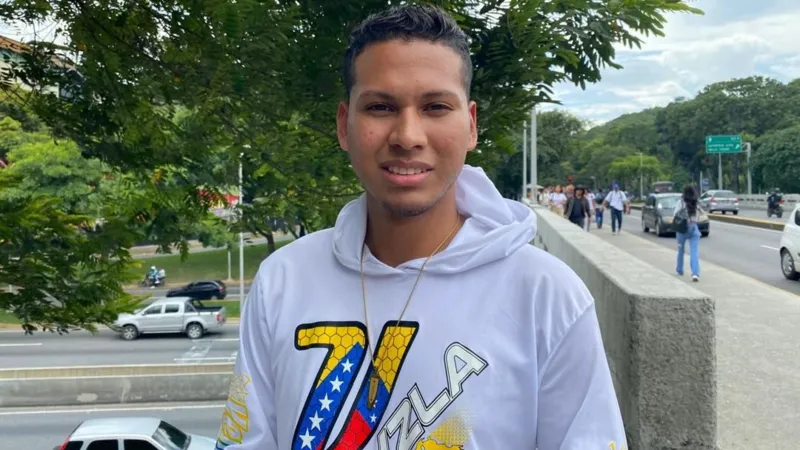 Ten months after fleeing in the night, Machado comes home to cheering crowds